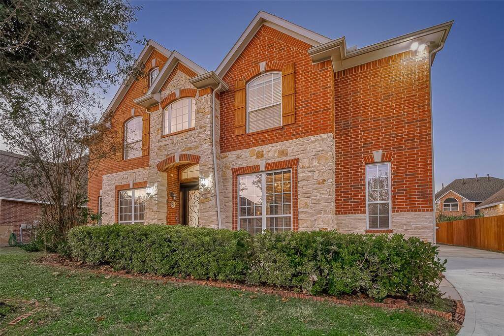 Don't miss out on this UNIQUE 4 bedrm/ 3.5 bath redesigned floor plan! Extended family area (HOA approved) adding 500 sqft! Features a striking brick & stone elevation w/ custom double iron-detailed doors and a recently repaved driveway.