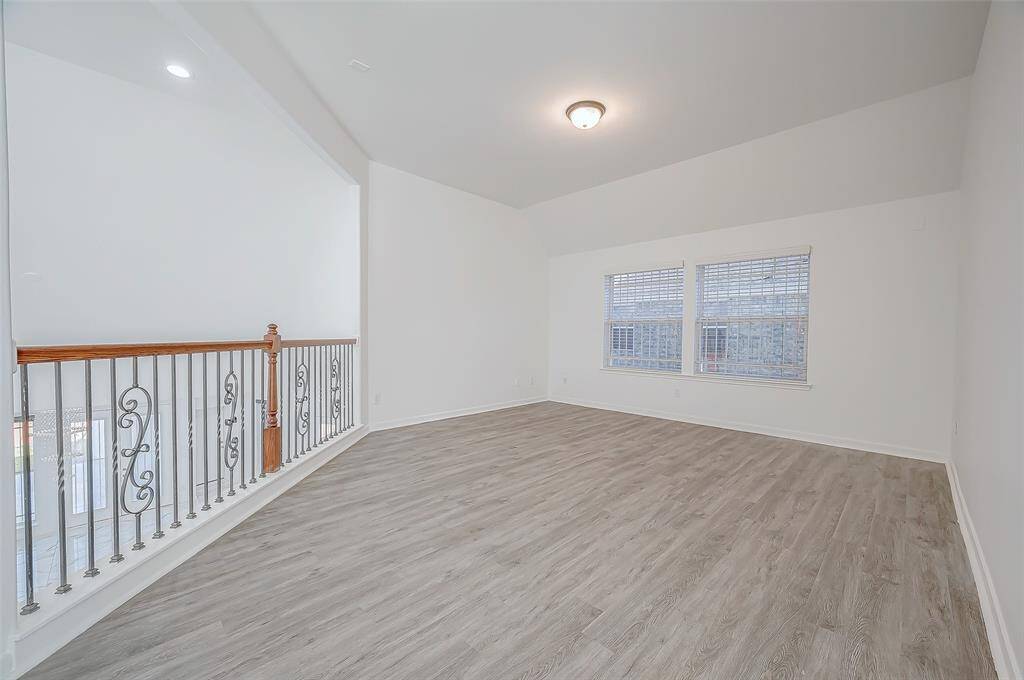 Game Room & Balcony: The upstairs remodeled game room has an added balcony overlooking the family room and foyer, providing a cohesive flow throughout the home.