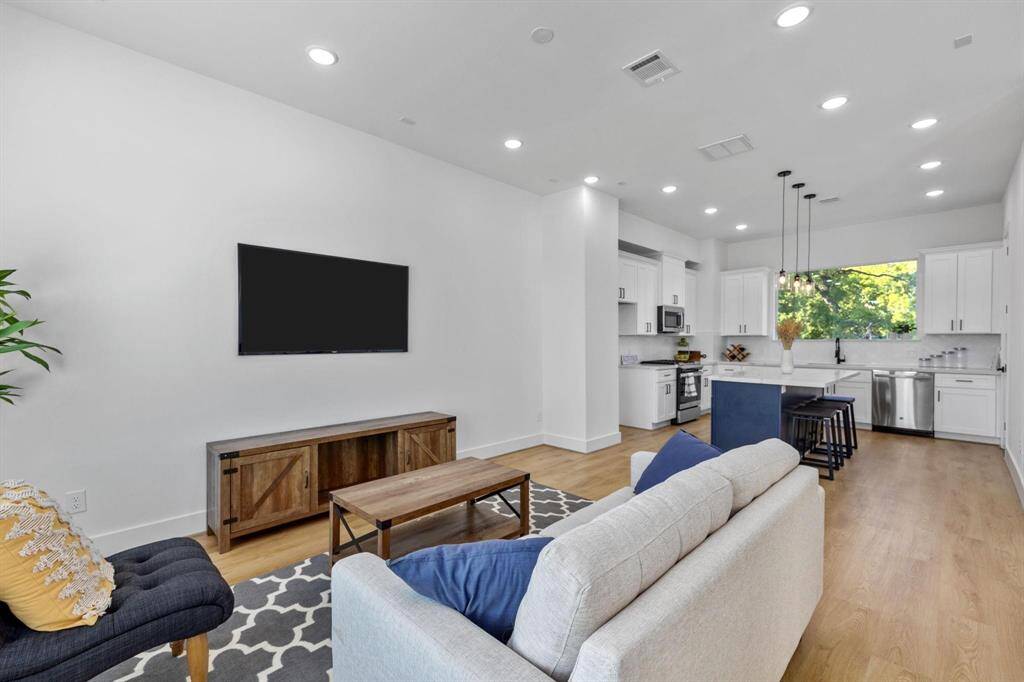 Expansive living room on second floor open to kitchen and dining room