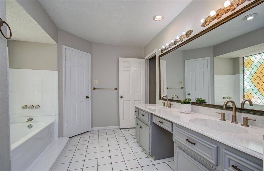 Primary ensuite features TWO walk in closets, stand up shower, soaking tub and separate water closet.