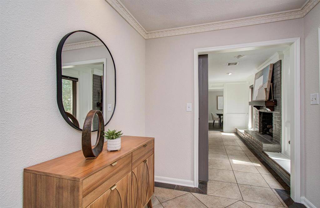 A charming foyer warmly welcomes you as you step into the home.