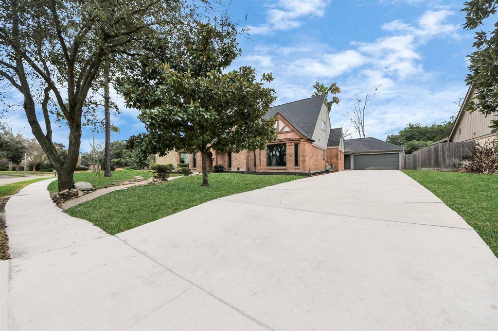 Plenty of green yard space separate from the pool area.