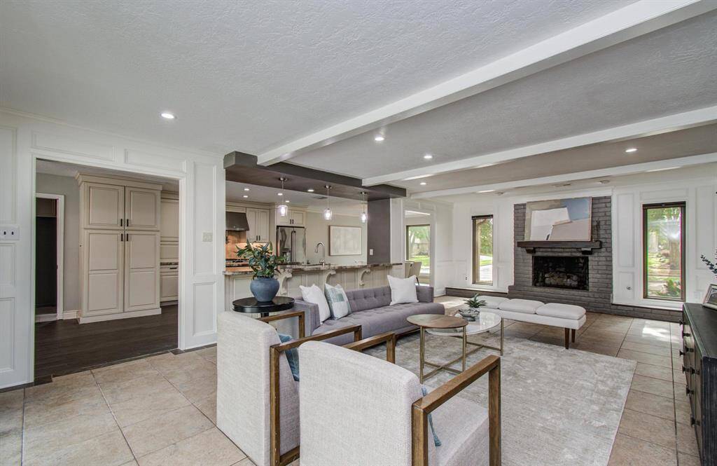 Spacious yet cozy family room with an open layout and a gas log fireplace.