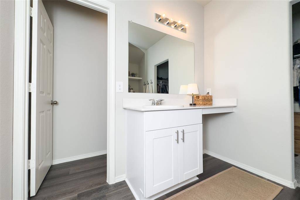 The primary bathroom offers plenty of space, updated shower head, good size closet, and built-in shelves that are perfect for storage.