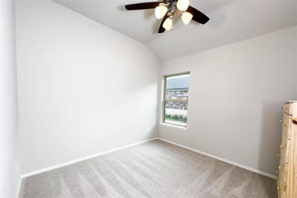 Cozy spare bedroom with a brand new ceiling fan.