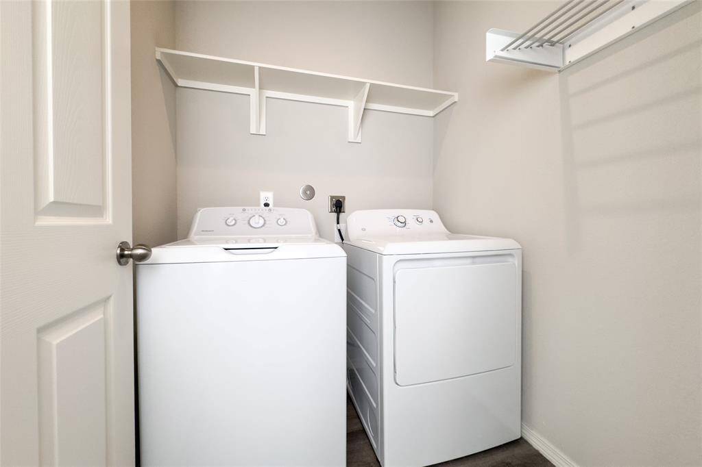 Spacious utility room with newly added built-in shelves.
