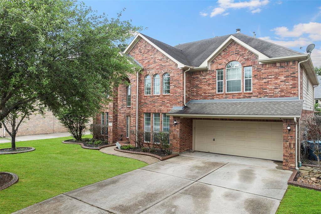 This home features soaring windows, a dramatic entryway, and also includes 3 car tandem garage.
