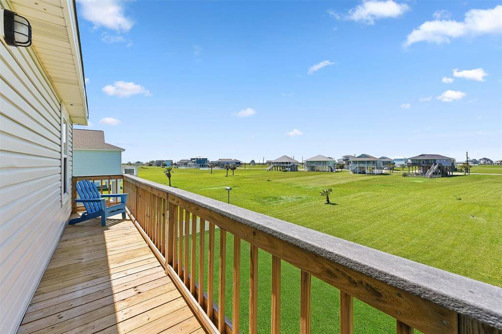 Enjoy peaceful mornings or sunset evenings from the private balcony overlooking the expansive green space.