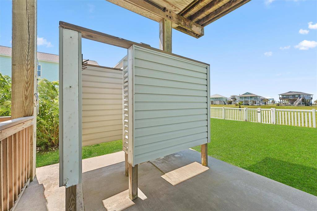 Outdoor shower perfect for rinsing off after a day at the beach, just steps from the backyard.