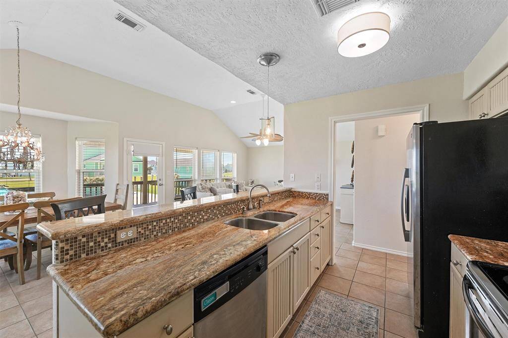 Kitchen view looking into the living and dining space, ideal for hosting and gathering.