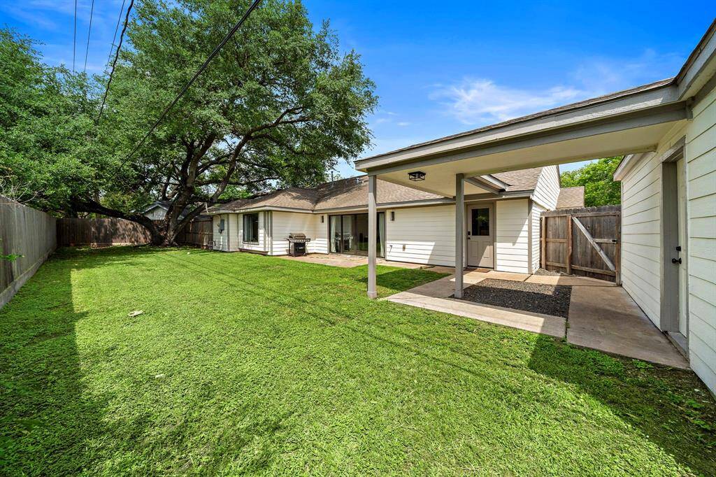 View of spacious backyard with gorgeous matured tree