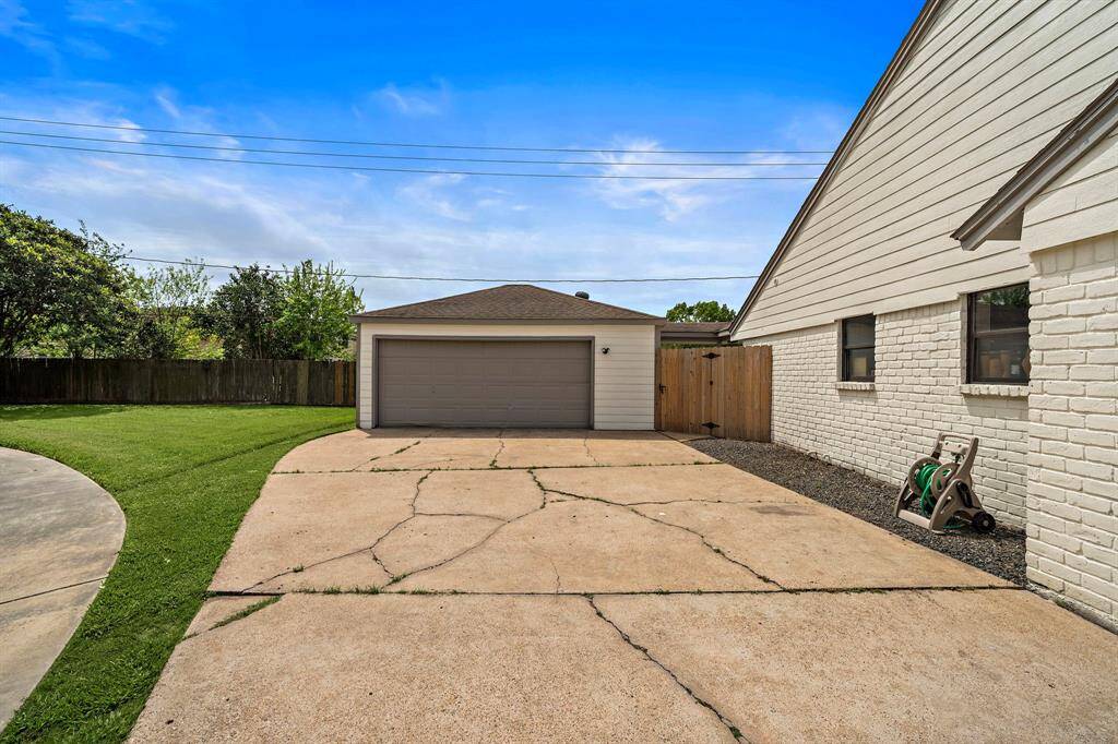 Detached garage with oversized driveway