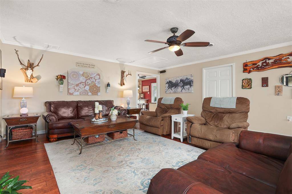 Notice the elegant wood flooring.