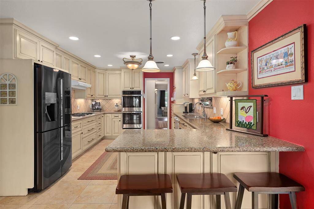 Discover the elegance of a fully renovated kitchen with stunning custom cabinets.