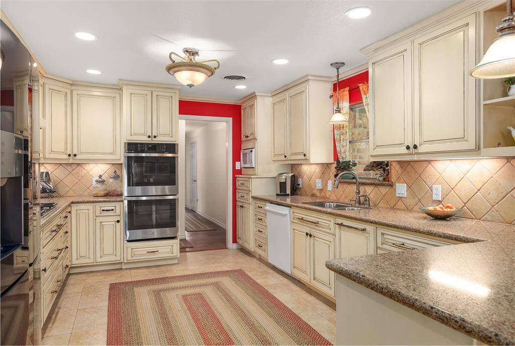 Featuring a sleek double oven, this kitchen is perfect for culinary enthusiasts.