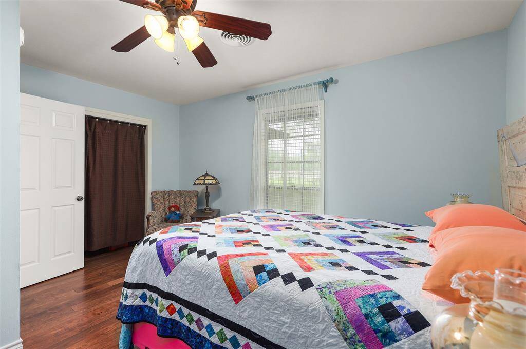 The window offers views of the front yard, enhancing the room with natural light.