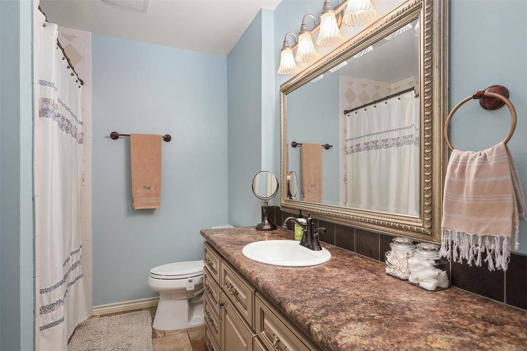Spacious bathroom conveniently located between the first and second bedrooms.
