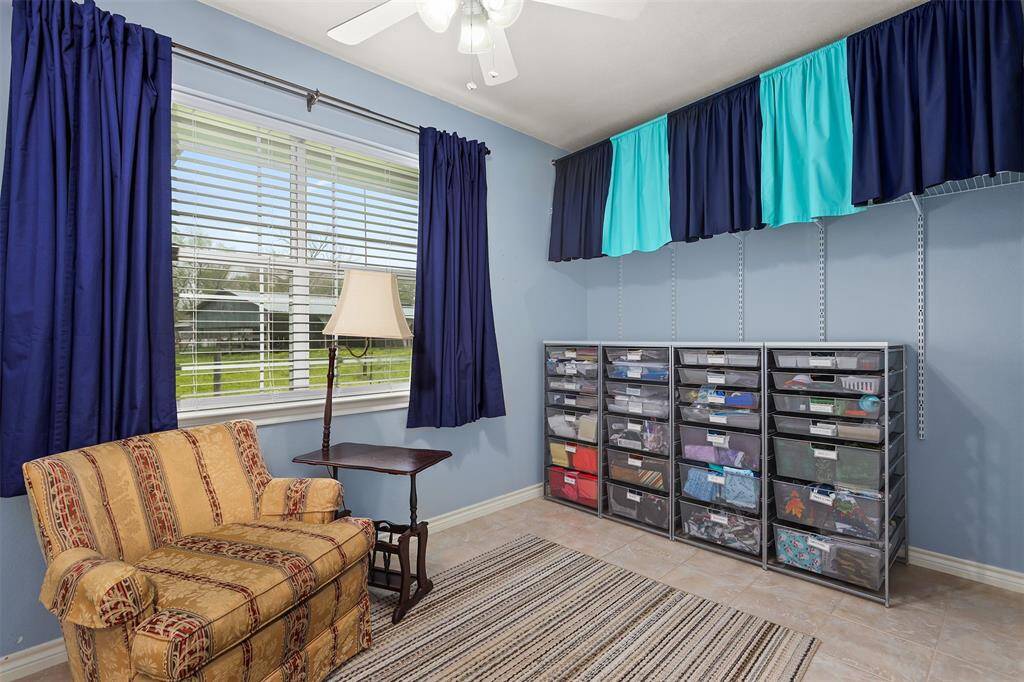 This versatile space, part of a recent addition, can serve as a study or craft room. The addition also includes a utility room and a spacious primary bedroom with an ensuite bathroom.
