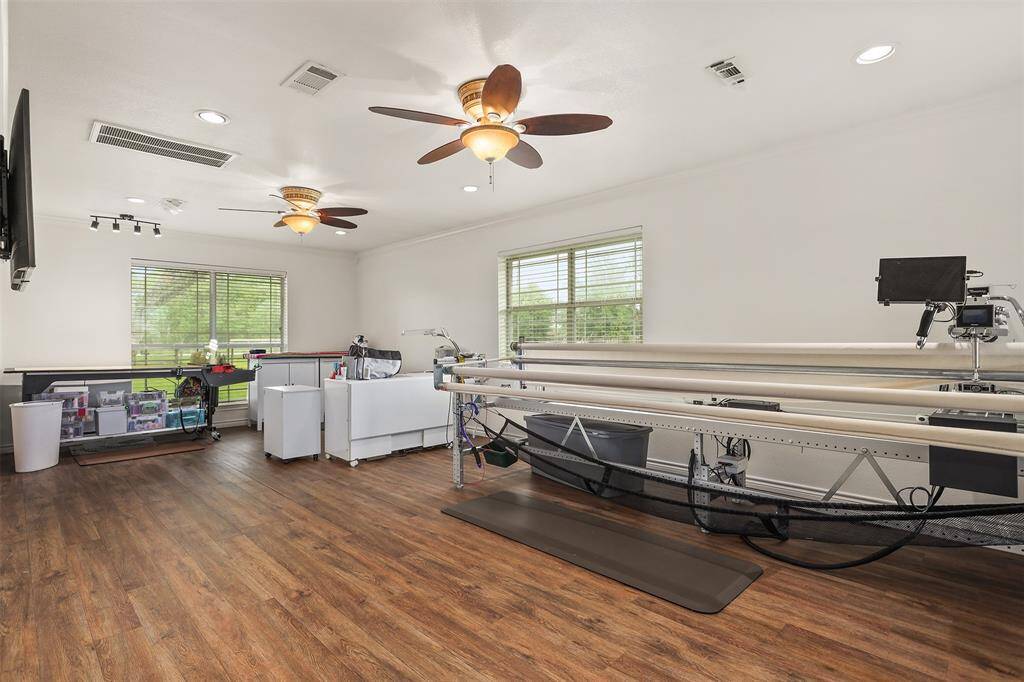 Spacious primary bedroom with abundant natural light, perfect for versatile use.