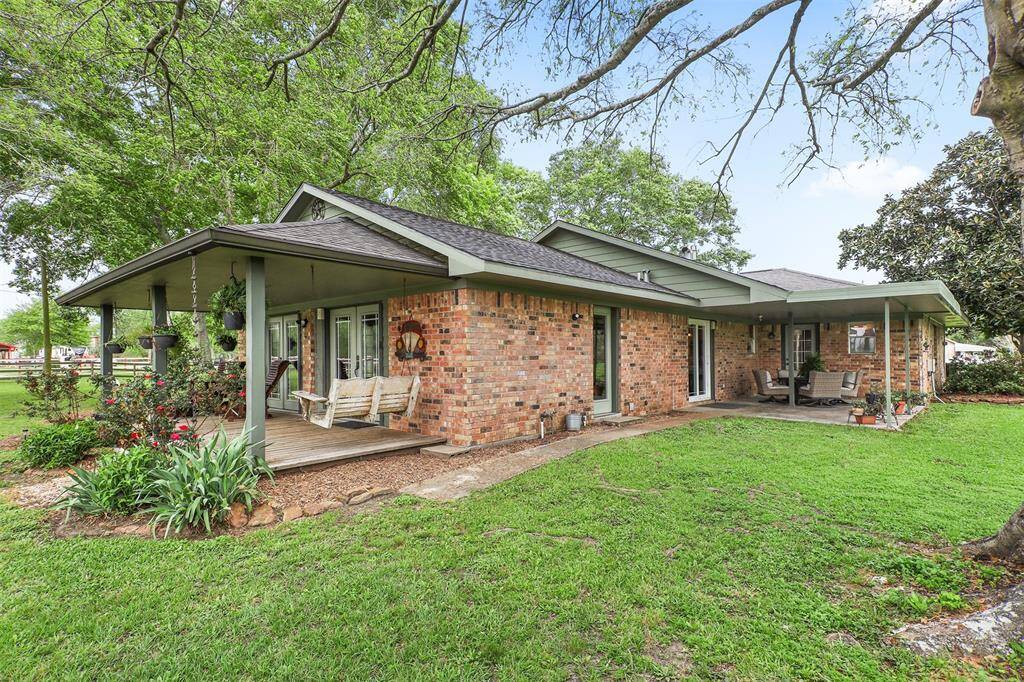 Here is your spacious, shaded yard. Surrounded by lush greenery and mature trees, offering a serene environment.