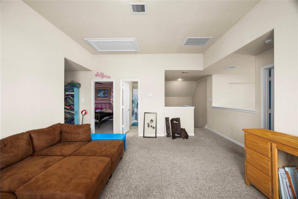 Versatile room adjacent to upstairs bedrooms and bath.