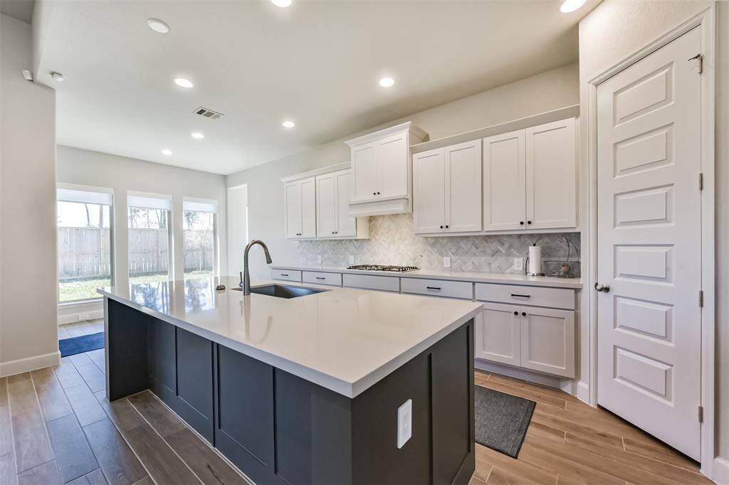 Kitchen opens to breakfast nook
