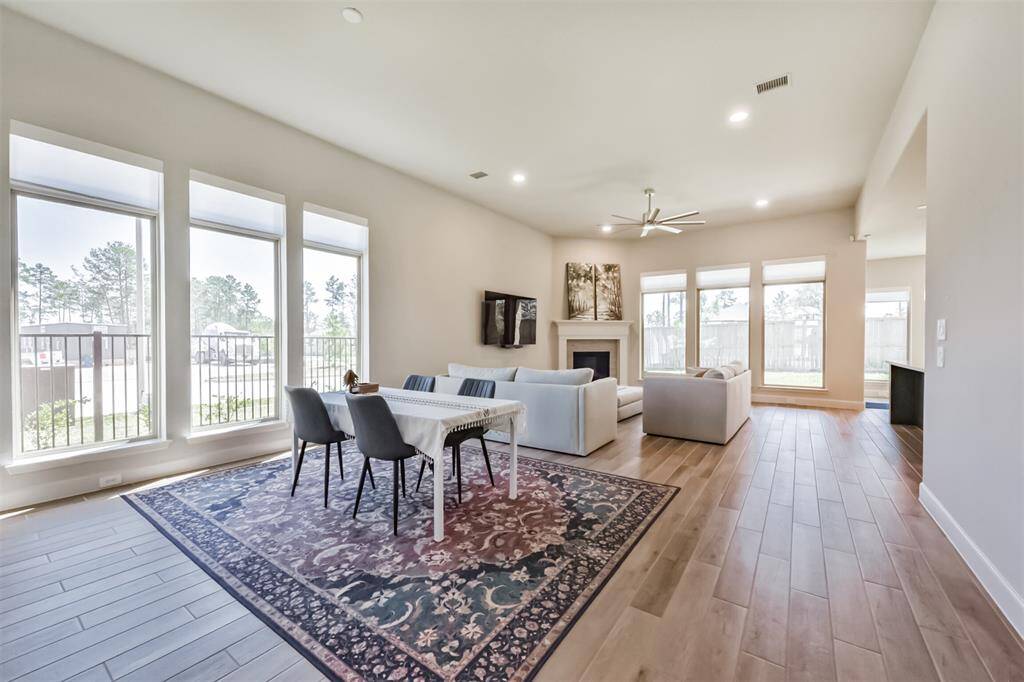 Dining area opens to living area- Natural lighting is gorgeous!