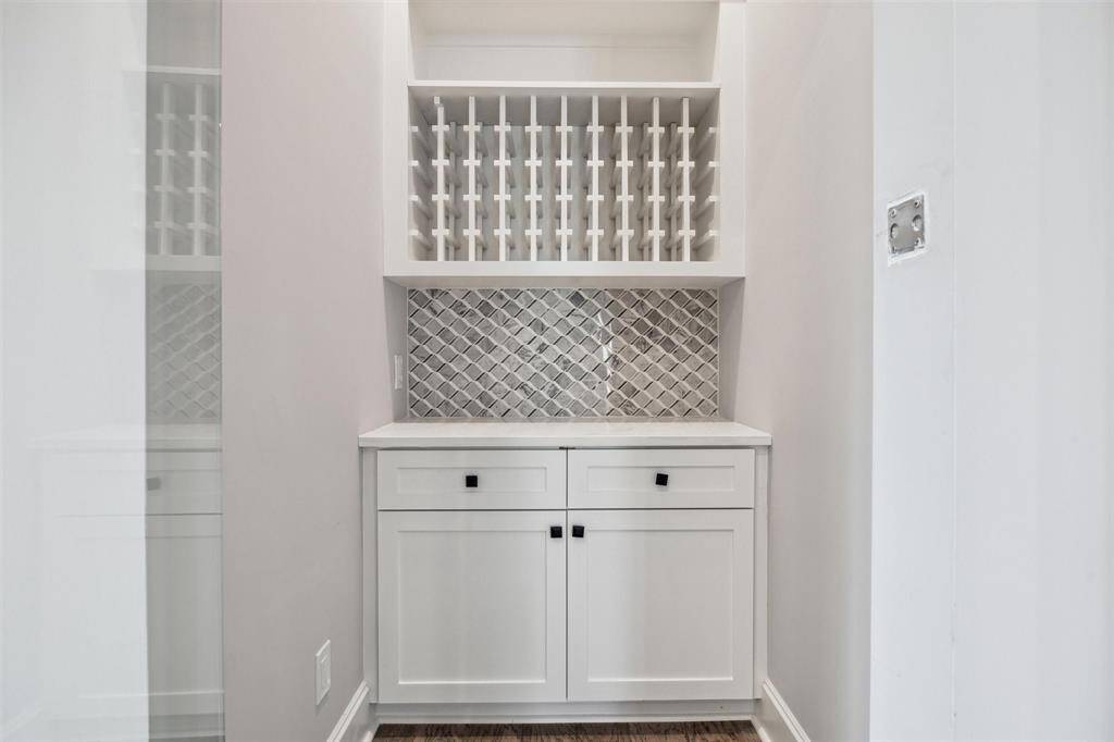 Service pantry with fitted storage adjacent in addition o a fitted walk-in pantry