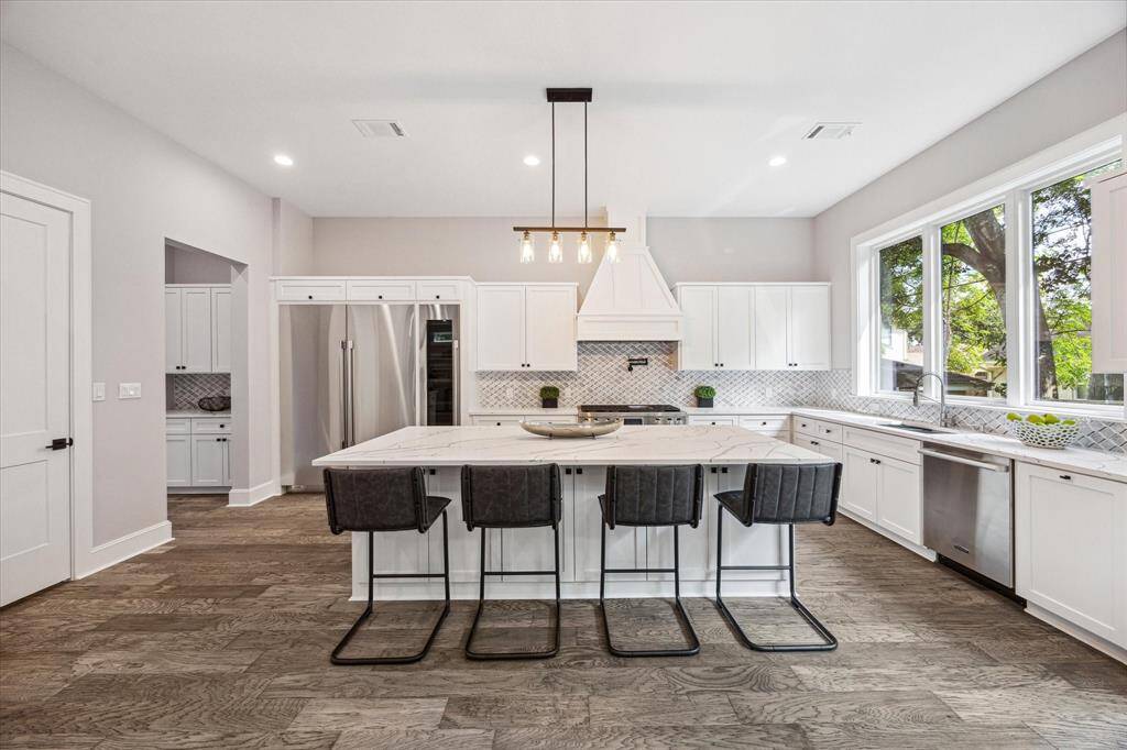 A generous island with ample storage in the custom cabinetry