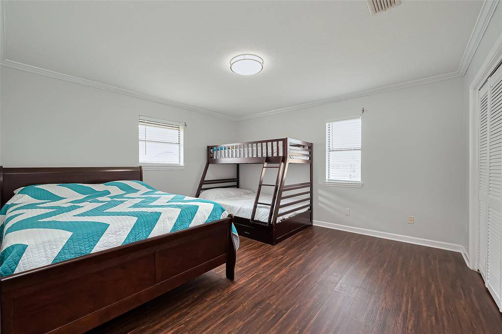 Spacious 2nd bedroom offers ample natural light will easily fit a double bed and a bunk bed, ideal for families or guests.