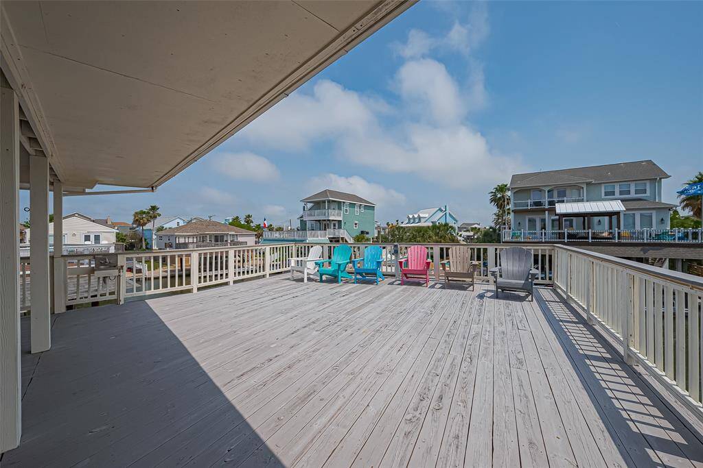 Large wooden deck offers a clear view of this coastal paradise.