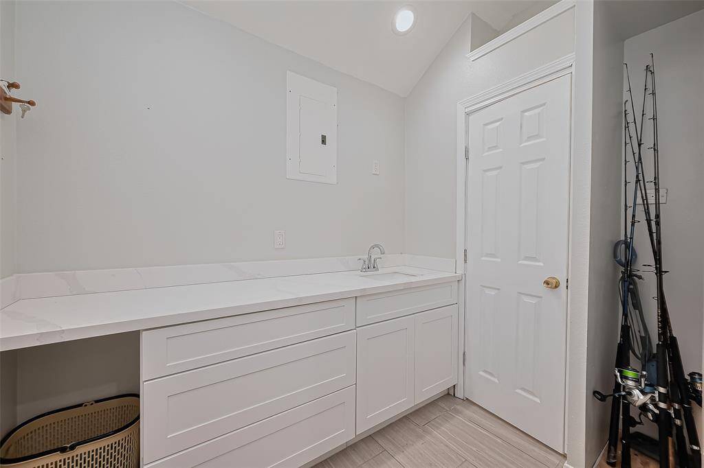 Upon entering the 1st floor you will find well-lit utility room with a door leading to a 2nd full bathroom.