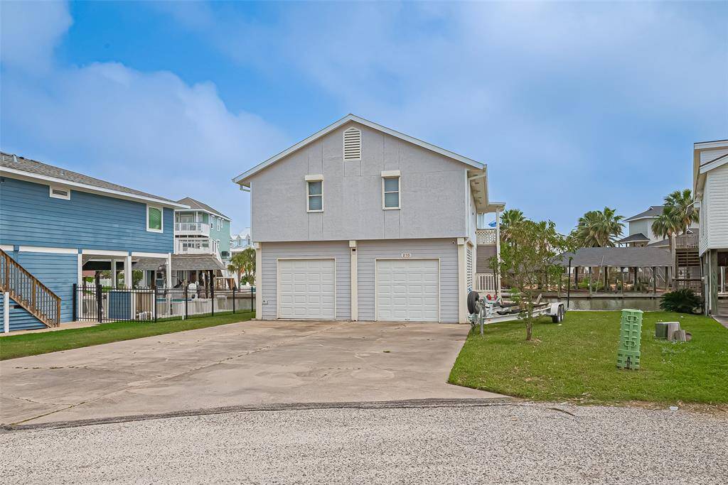 Spacious driveway and a canal view.