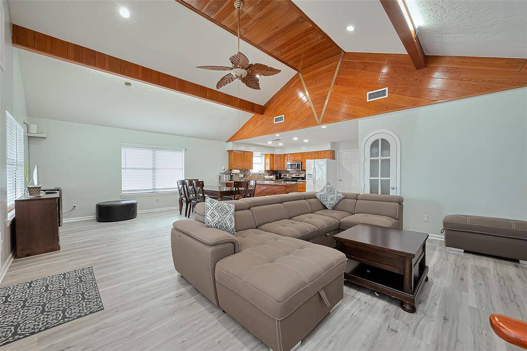 Open-plan living area offering a functional and inviting space for gatherings.