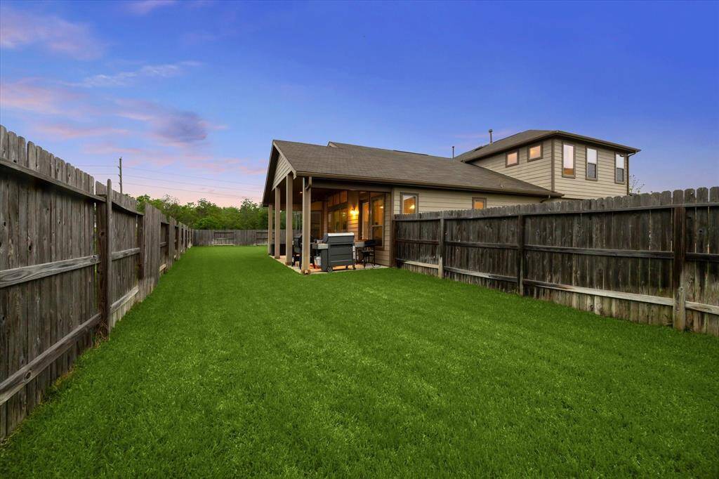 Here’s the second expansive section of the backyard—offering even more room to enjoy, entertain, or make your own.