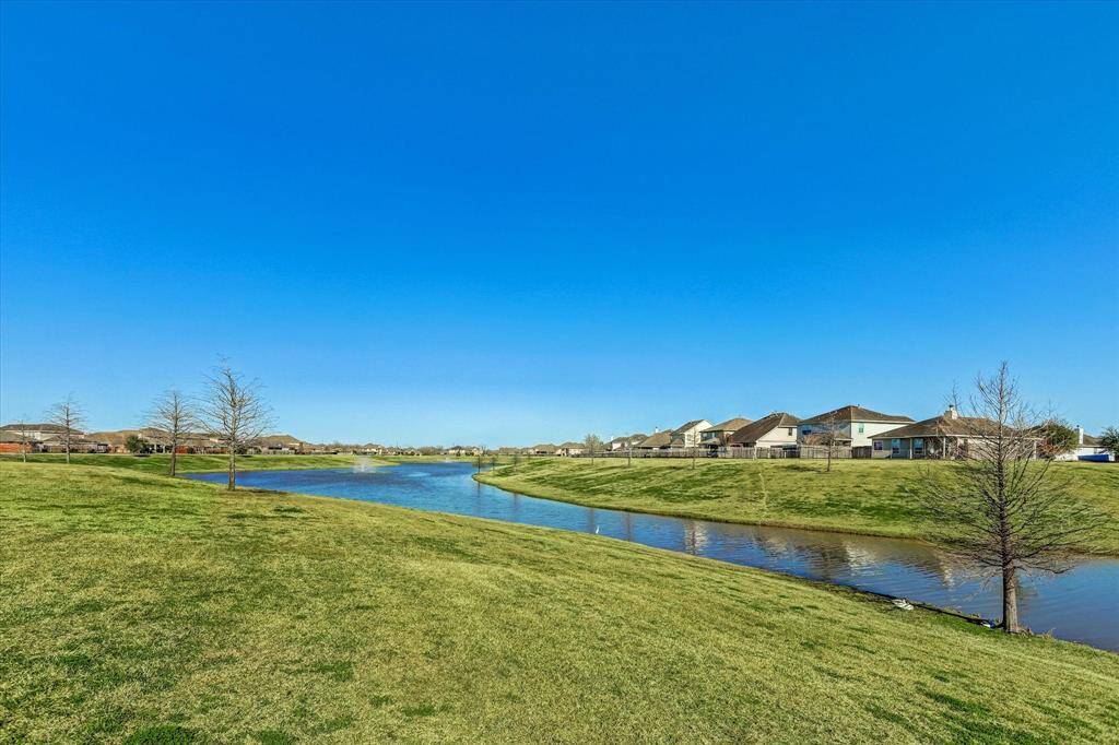 Just steps from your front door, take in the peaceful beauty of a serene lake view—one of the many perks of this exceptional neighborhood.