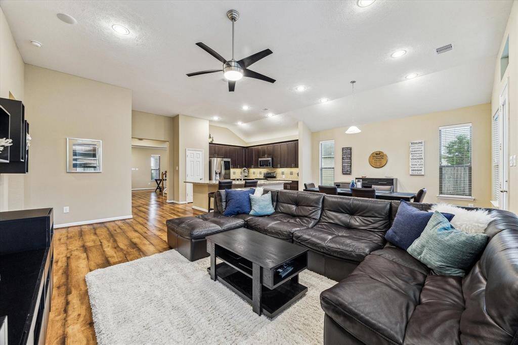 As the heart of the home, this space is designed for both comfort and connection. Soaring ceilings amplify the already generous layout, making it feel even more open and inviting.