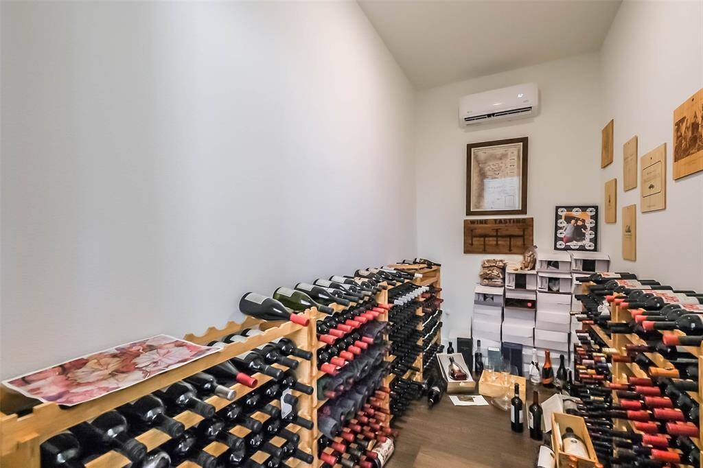 Wonderful Wine Room with separate cooling. This room would make fantastic extra storage as well!