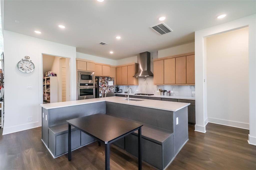Built in seating with extra storage underneath add charm as well as comfort to the spacious Kitchen