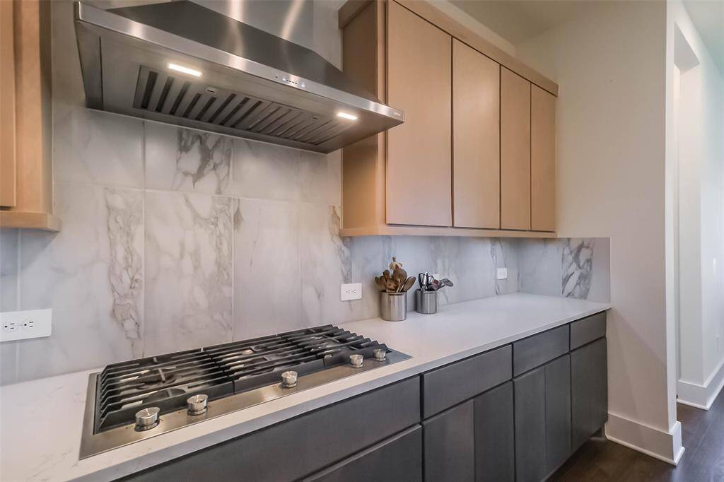 Along with an abundance of cabinets, there's also a large walk-in pantry