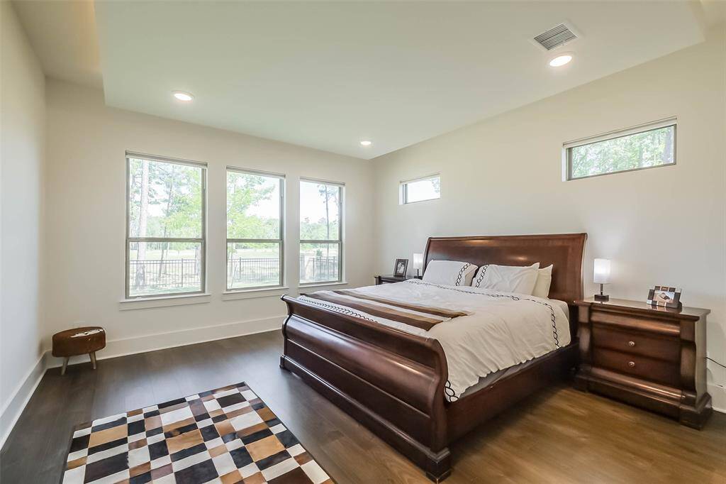 Primary Bedroom offers serene views as well as romantic hidden lighting around the tray ceiling