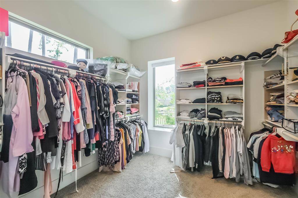 Check out this walk-in closet with not just 1 but 2 windows to brighten up your day