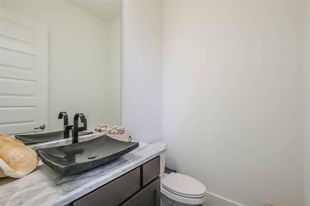 A guest half bath is also offered on the first floor