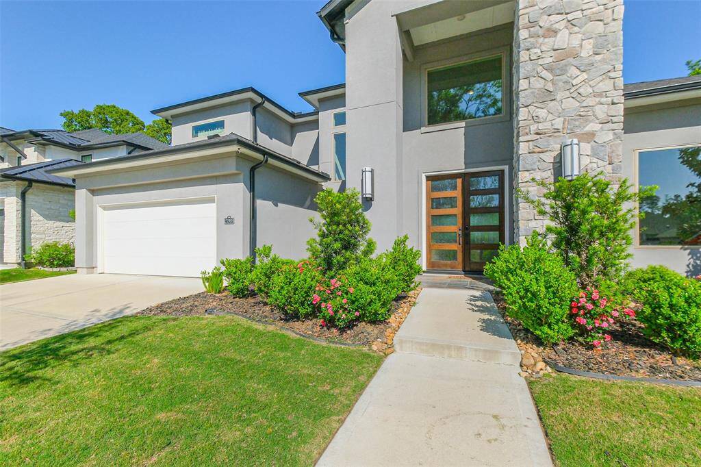 Picture windows throughout the home, along with the double 5 panel front doors, allow plenty of natural light in