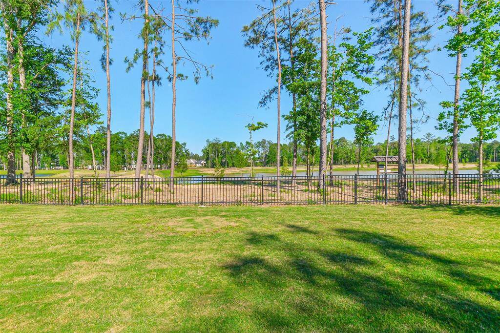 The tranquility of the back green space, walking trail, and lake make this property stand out from all the rest!