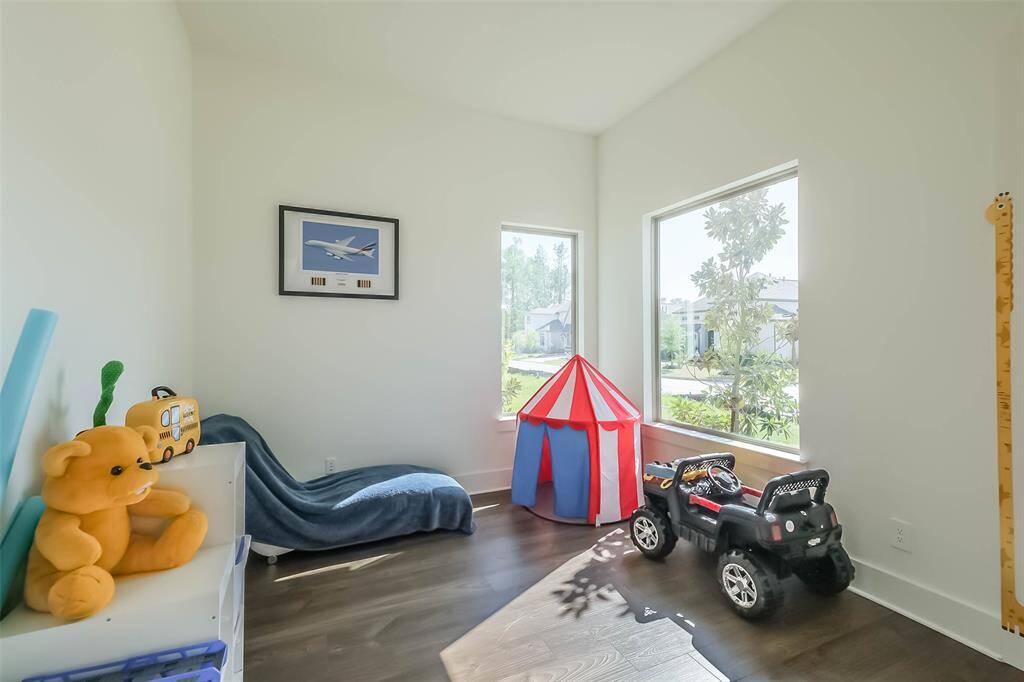 Versatile front office is currently used as a play room.