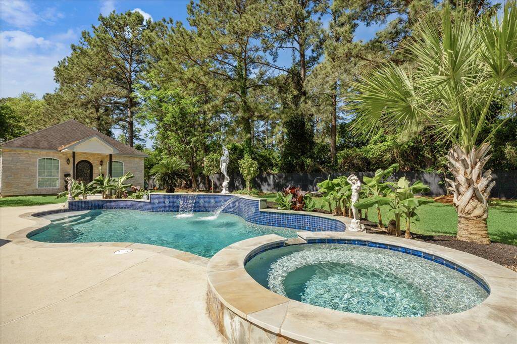 This spacious home features a well-maintained exterior with a unique putting green in the lush backyard. The house boasts a modern design with large windows, palm trees, and a welcoming front entrance, offering a luxurious and recreational living experience.
