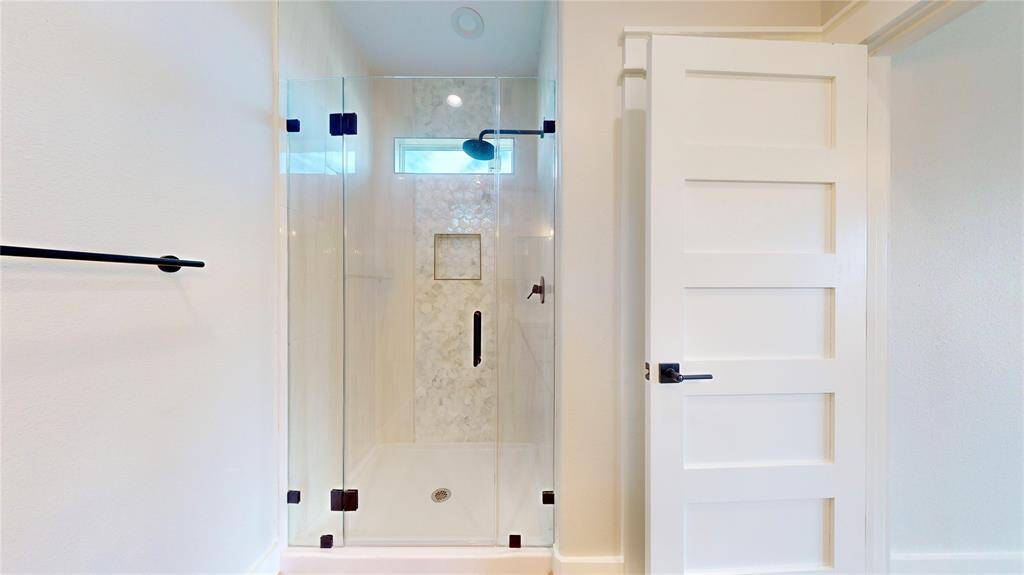 Bath 3 with custom designer tile and linen closet