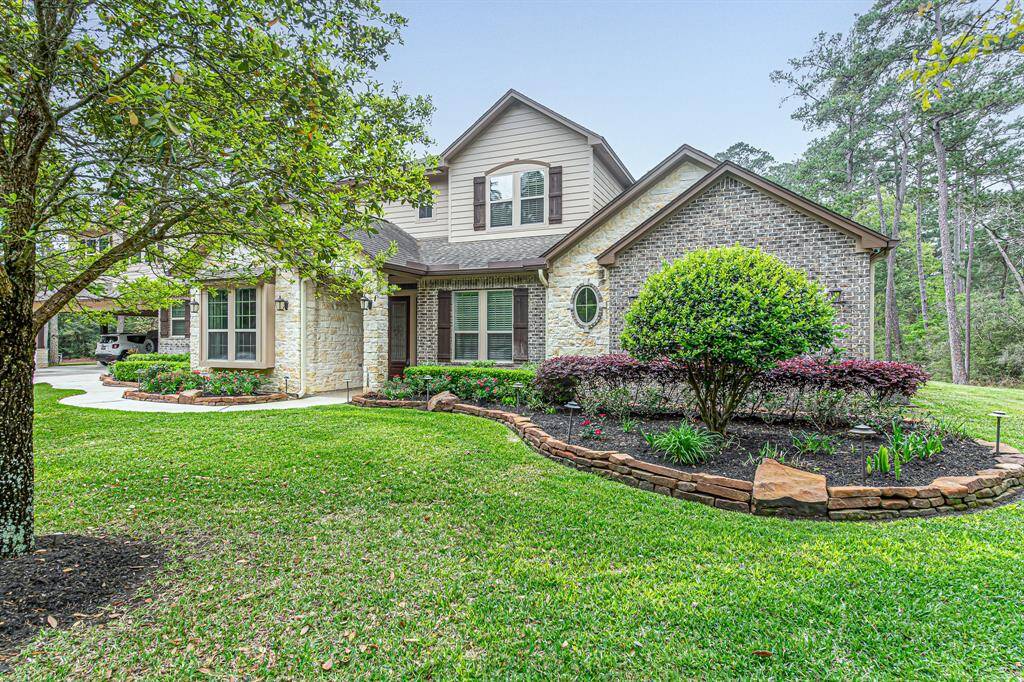 Beautiful landscaping throughout front lawn with upgraded landscaping lighting.