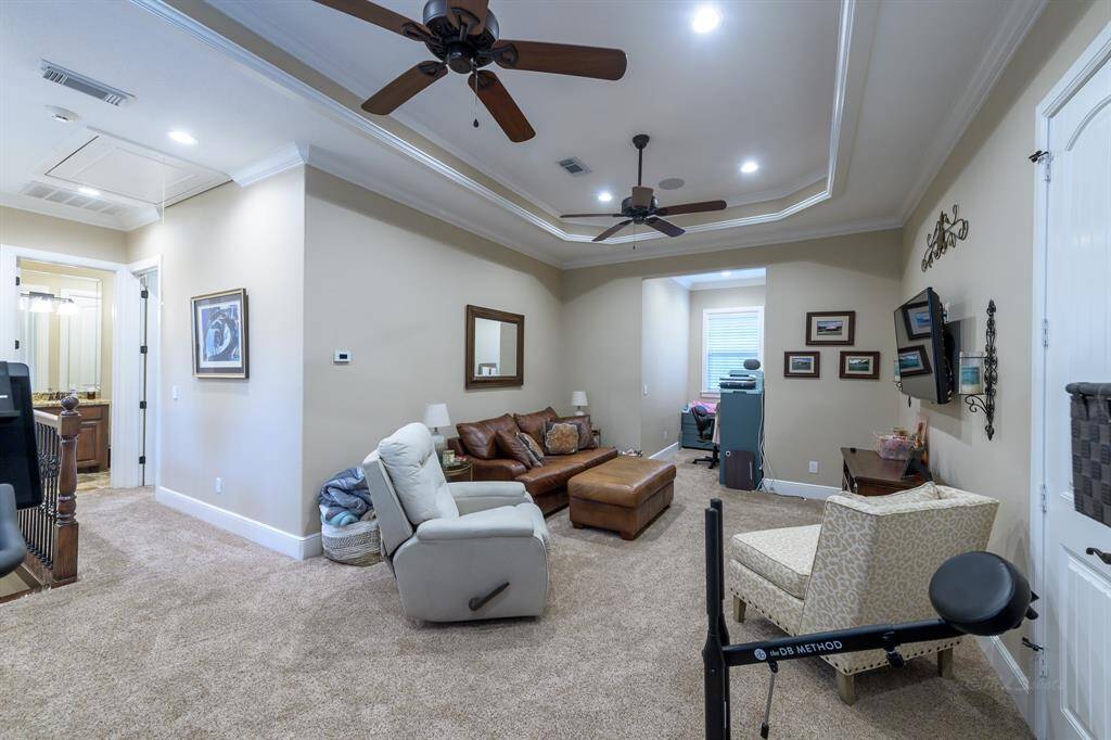 Massive upstairs game room with dormer. An attic branches off game room.
